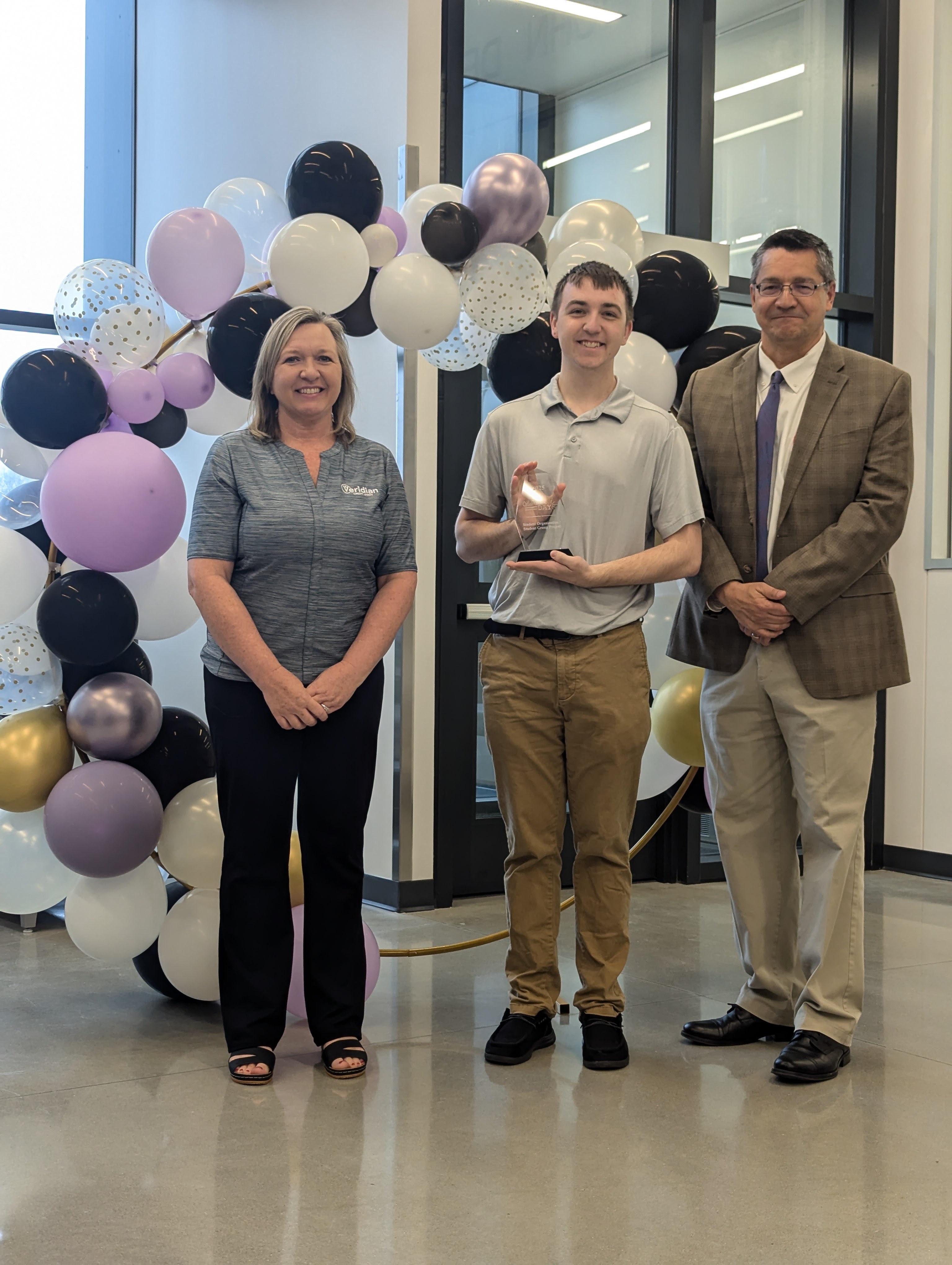 Lane Rogers posing with Julie Gage from Veridian and Provost Herrera